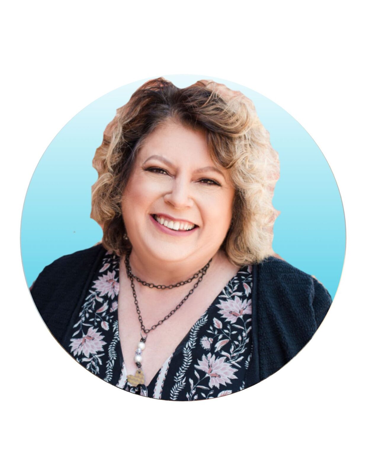 Smiling woman with curly hair against a blue background.